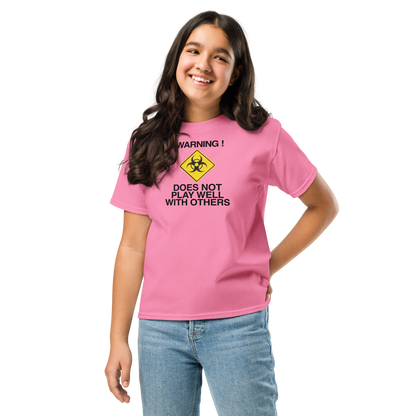 "!Warning! Does Not Play Well With Others" printed on a azalea youth classic tee worn by a female