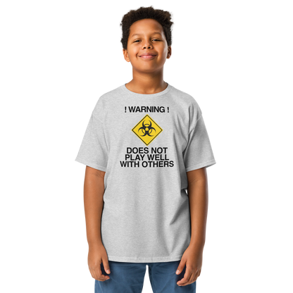 "!Warning! Does Not Play Well With Others" printed on a sport grey youth classic tee worn by a male