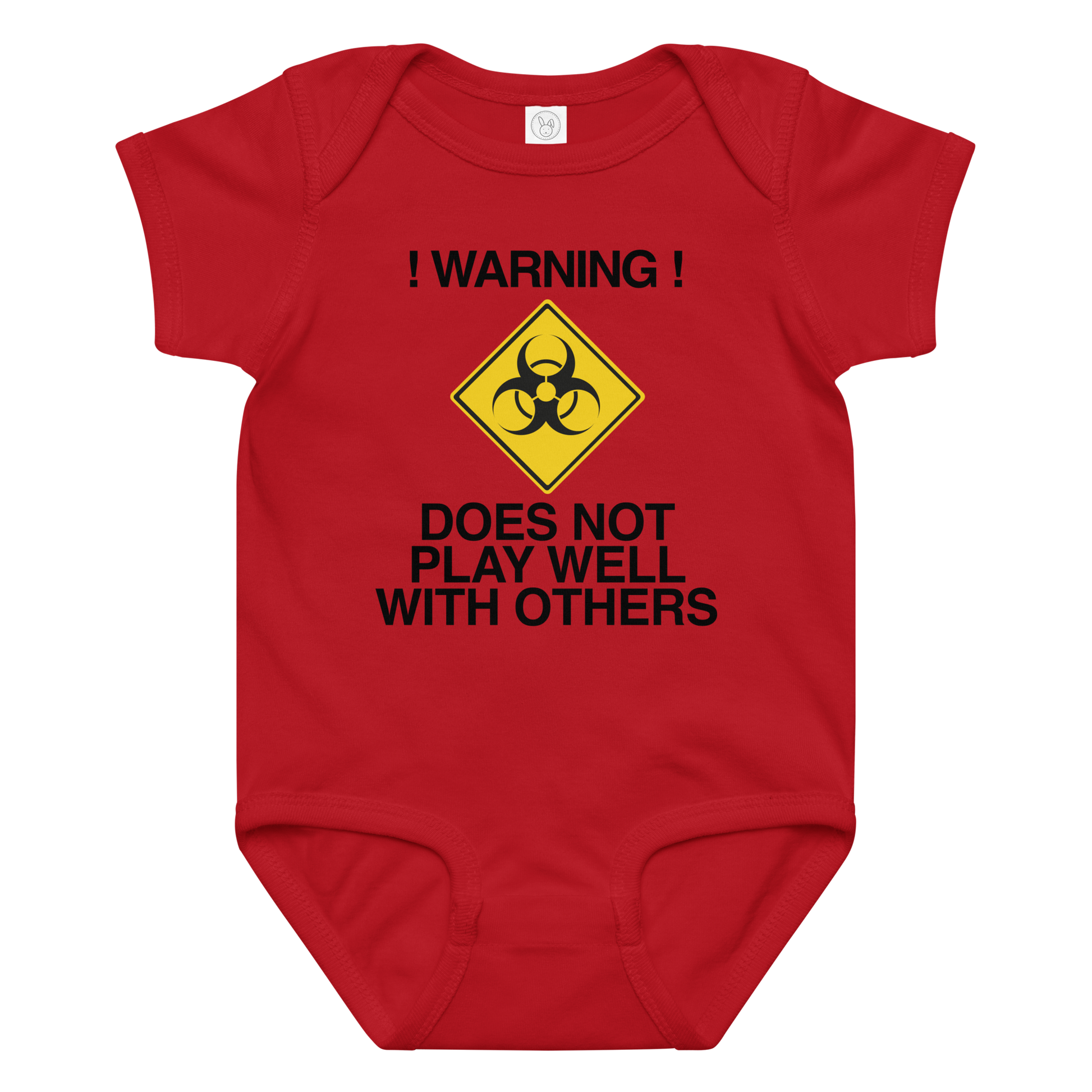 "!Warning! Does Not Play Well With Others" printed on a red baby jersey bodysuit laying on a flat surface amongst other clothes