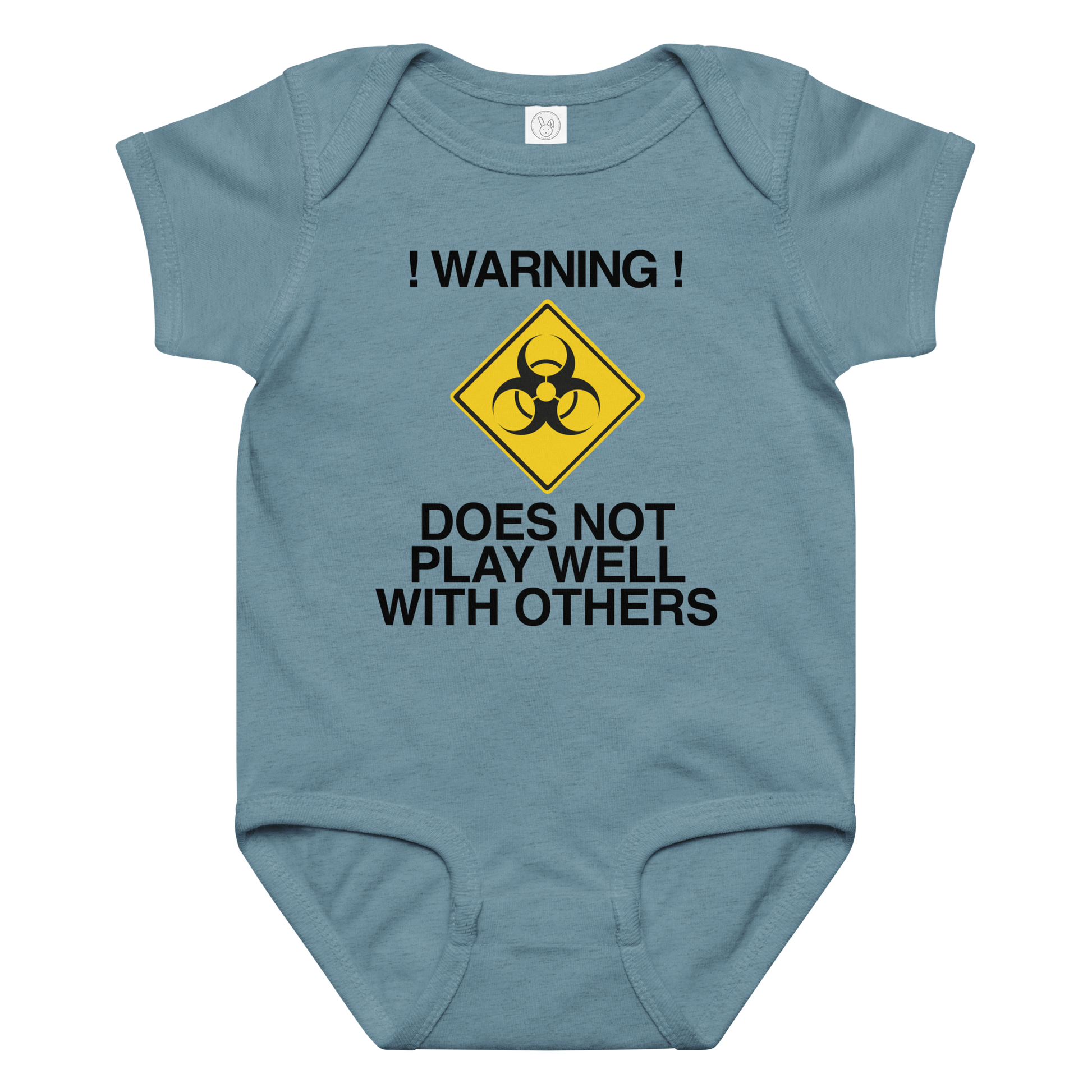 "!Warning! Does Not Play Well With Others" printed on a vintage indigo baby jersey bodysuit laying on a flat surface amongst other clothes