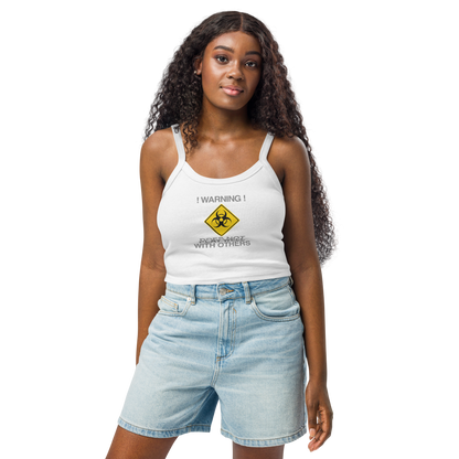 "!Warning! Does Not Play Well With Others" printed on a solid white blend women's micro-rib tanktop worn by a female