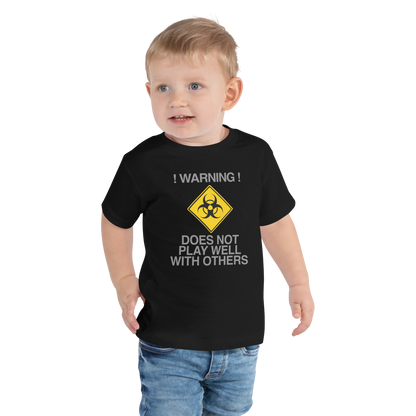 "!Warning! Does Not Play Well With Others" printed on a black toddler short sleeve tee worn by a male