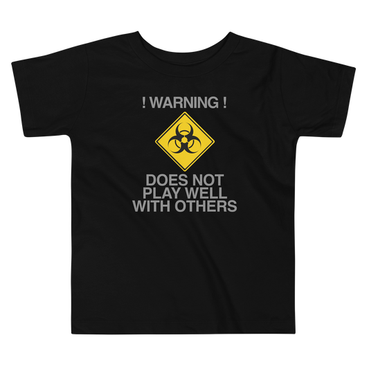 "!Warning! Does Not Play Well With Others" printed on a black toddler short sleeve tee laying on a flat surface