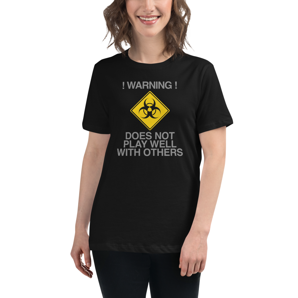 "!Warning! Does Not Play Well With Others" printed on a black women's relaxed t-shirt worn by a female