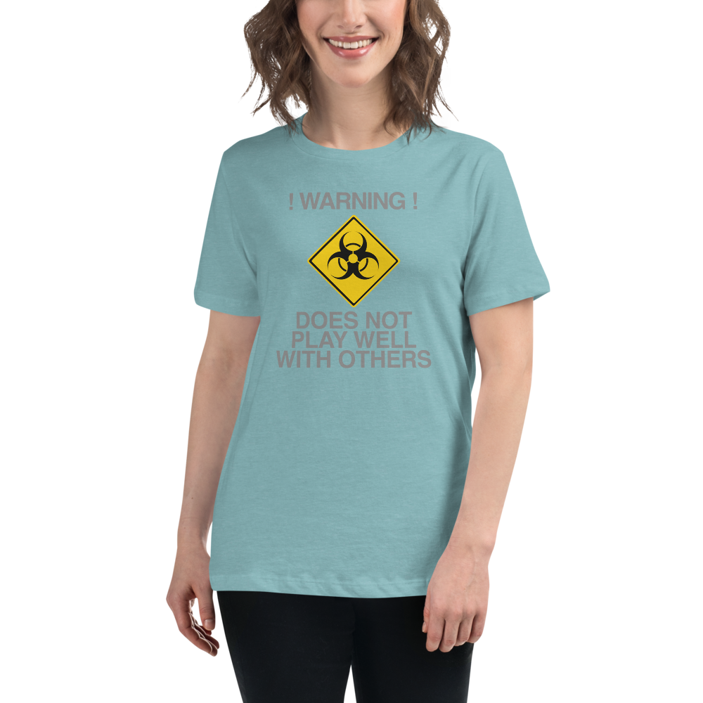 "!Warning! Does Not Play Well With Others" printed on a heather blue lagoon women's relaxed t-shirt worn by a female