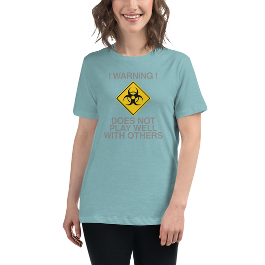 "!Warning! Does Not Play Well With Others" printed on a heather blue lagoon women's relaxed t-shirt worn by a female