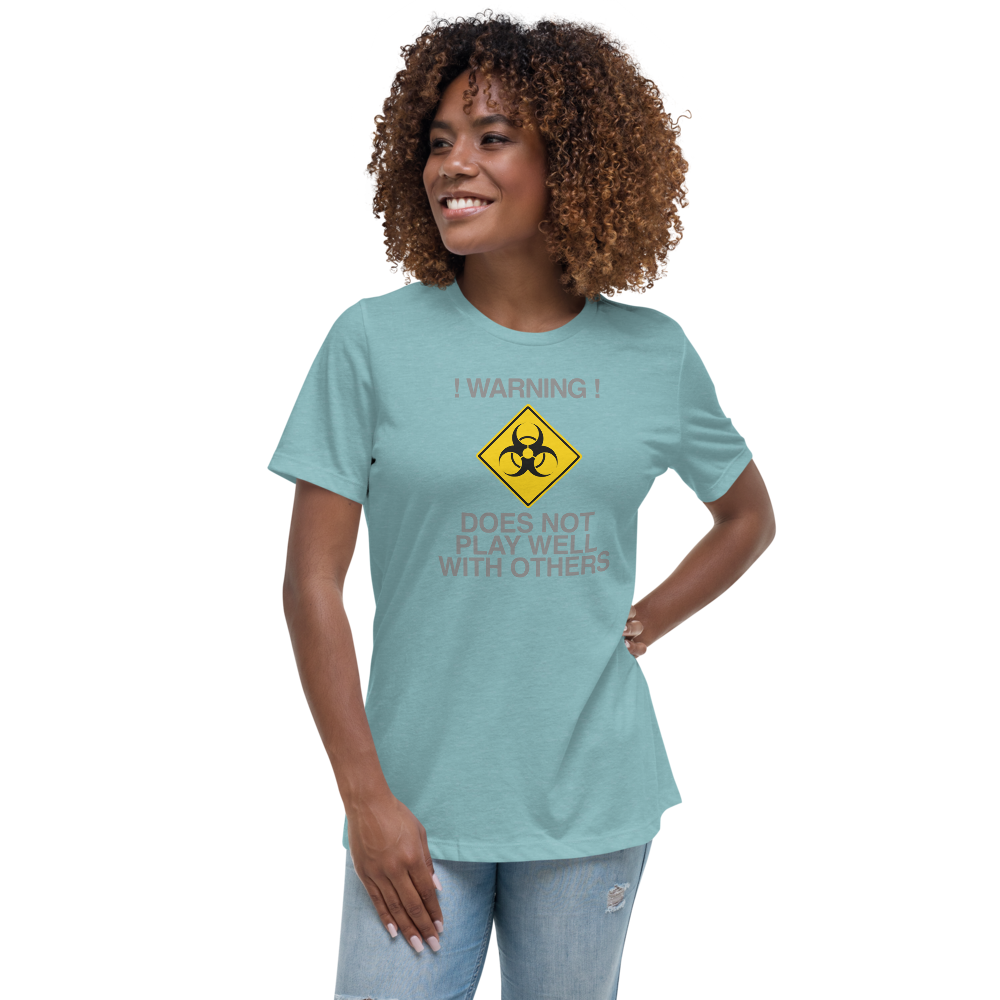 "!Warning! Does Not Play Well With Others" printed on a heather blue lagoon women's relaxed t-shirt worn by a female