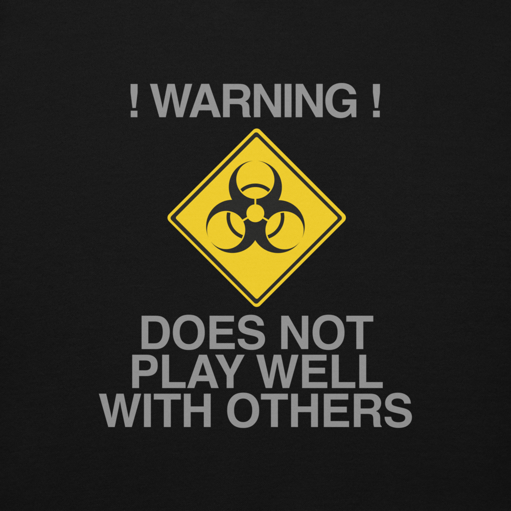 "!Warning! Does Not Play Well With Others" printed on a black background