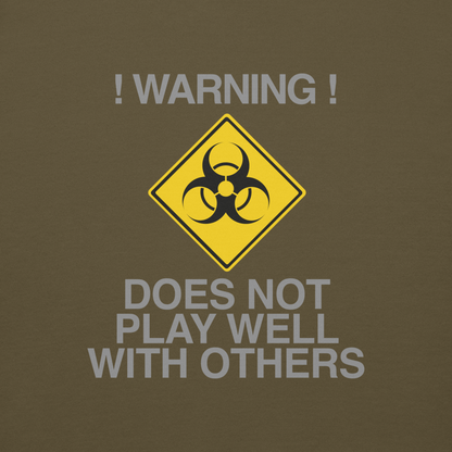 "!Warning! Does Not Play Well With Others" printed on a military green background