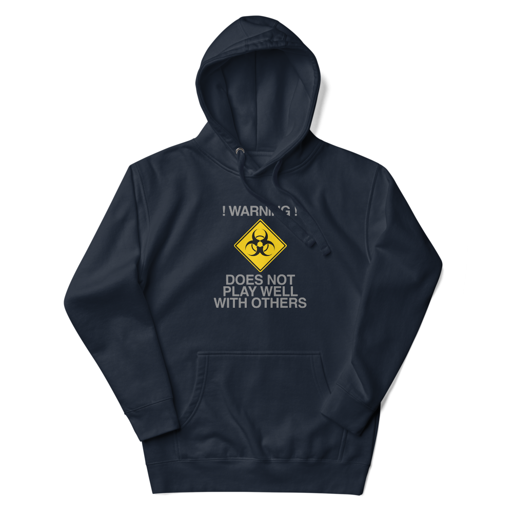 "!Warning! Does Not Play Well With Others" printed on a navy blazer unisex hoodie laying on a flat surface with the hood up