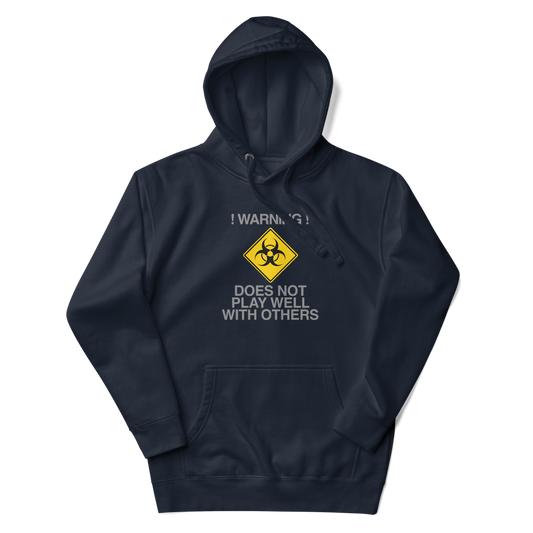 "!Warning! Does Not Play Well With Others" printed on a navy blazer unisex hoodie laying on a flat surface with the hood up