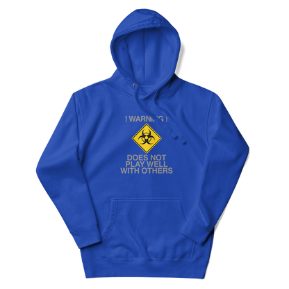 "!Warning! Does Not Play Well With Others" printed on a team royal unisex hoodie laying on a flat surface with the hood up