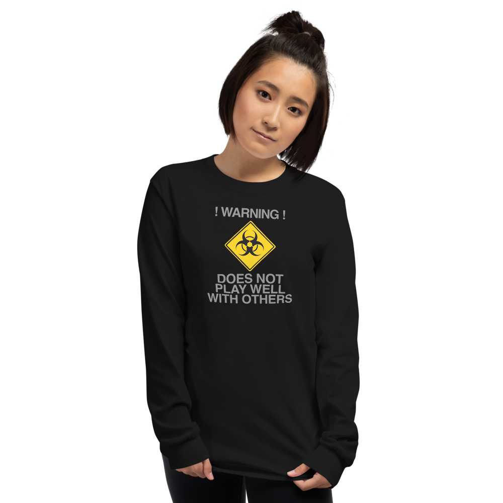"!Warning! Does Not Play Well With Others" printed on a black men's long sleeve shirt worn by a female
