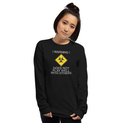 "!Warning! Does Not Play Well With Others" printed on a black men's long sleeve shirt worn by a female
