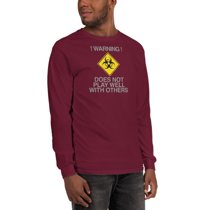 "!Warning! Does Not Play Well With Others" printed on a maroon men's long sleeve shirt worn by a male