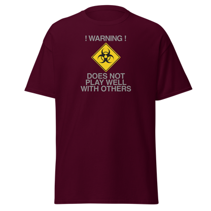 "!Warning! Does Not Play Well With Others" printed on a maroon on an invisible body