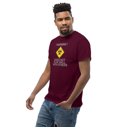 "!Warning! Does Not Play Well With Others" printed on a maroon unisex classic tee worn by a male