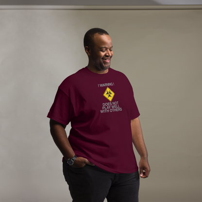 "!Warning! Does Not Play Well With Others" printed on a maroon unisex classic tee worn by a male
