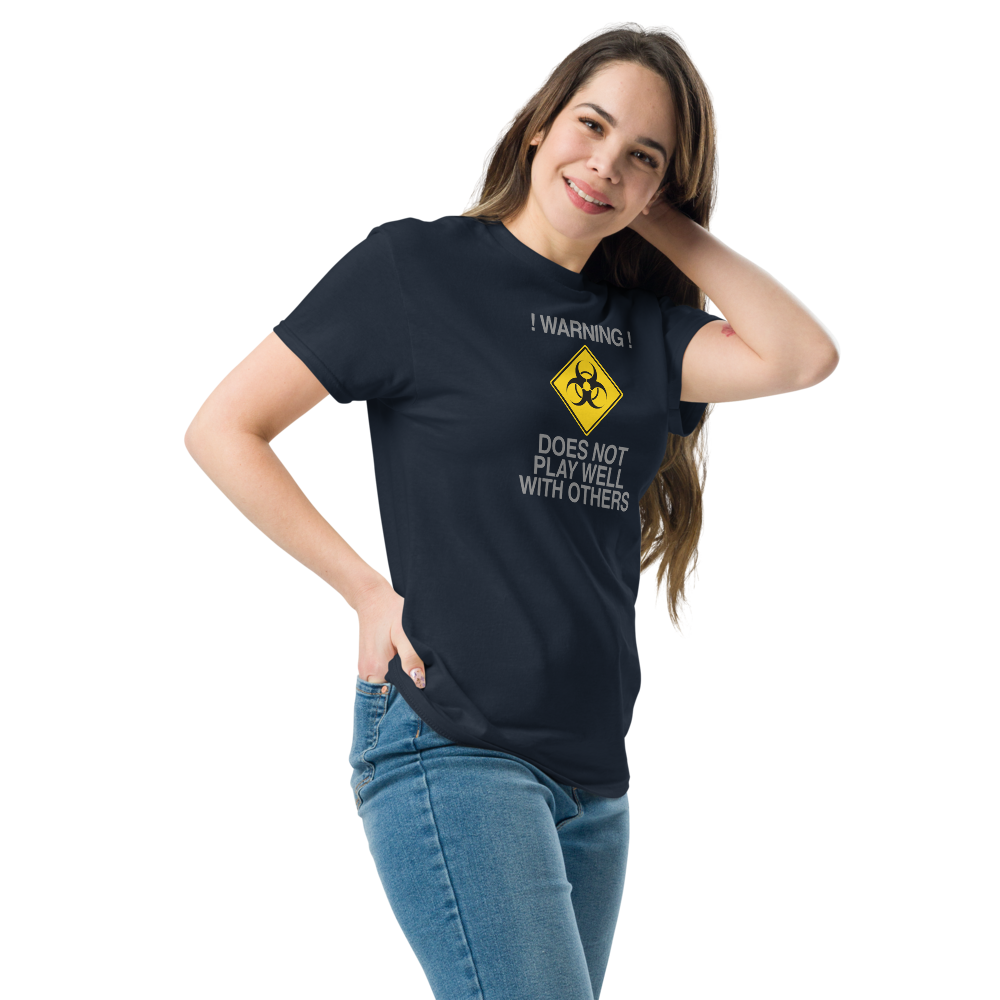 "!Warning! Does Not Play Well With Others" printed on a navy unisex classic tee worn by a female