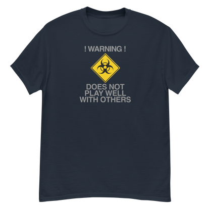 "!Warning! Does Not Play Well With Others" printed on a navy unisex classic tee laying on a flat surface