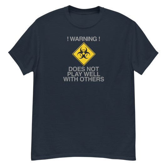 "!Warning! Does Not Play Well With Others" printed on a navy unisex classic tee laying on a flat surface