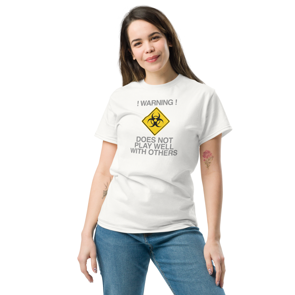 "!Warning! Does Not Play Well With Others" printed on a white unisex classic tee worn by a female