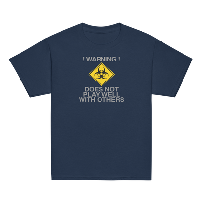 "!Warning! Does Not Play Well With Others" printed on a navy youth classic tee laying on a flat surface