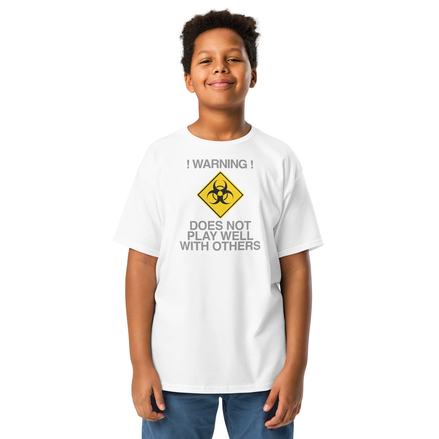 "!Warning! Does Not Play Well With Others" printed on a white youth classic tee worn by a male