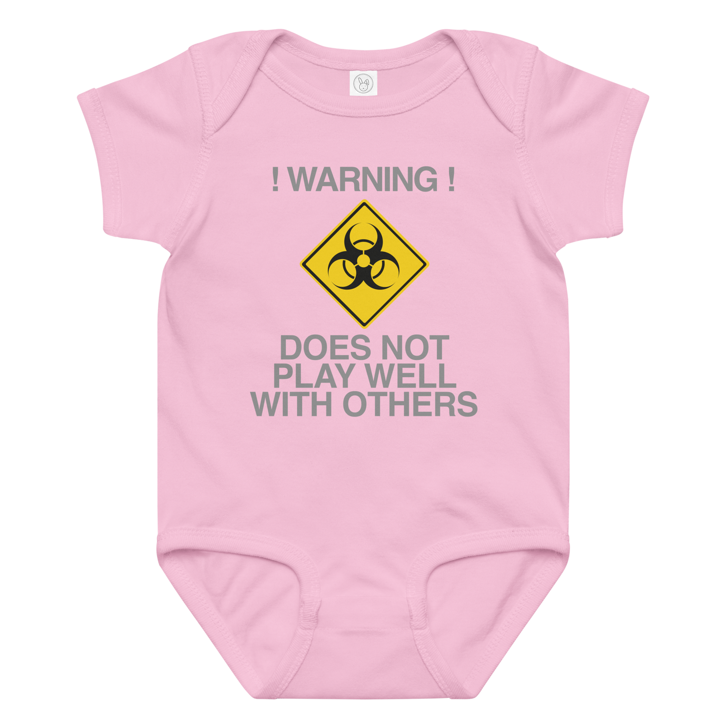 "!Warning! Does Not Play Well With Others" printed on a pink baby jersey bodysuit laying on a flat surface amongst other clothes