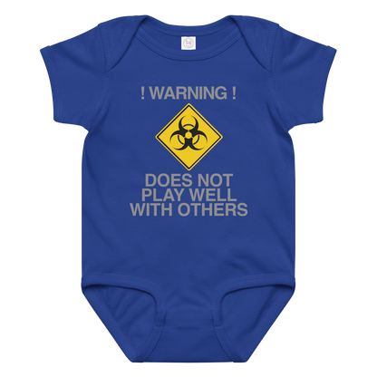 "!Warning! Does Not Play Well With Others" printed on a royal baby jersey bodysuit laying on a flat surface amongst other clothes