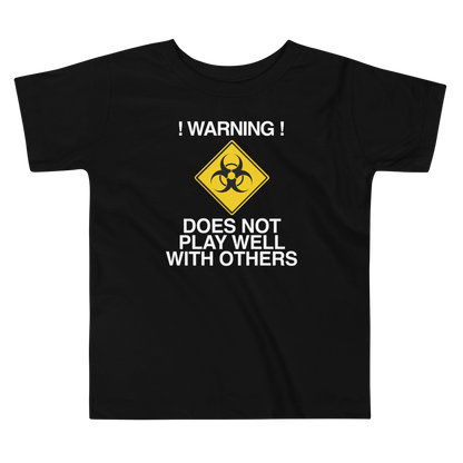 "!Warning! Does Not Play Well With Others" printed on a black toddler short sleeve tee laying on a flat surface