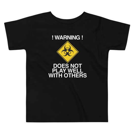 "!Warning! Does Not Play Well With Others" printed on a black toddler short sleeve tee laying on a flat surface