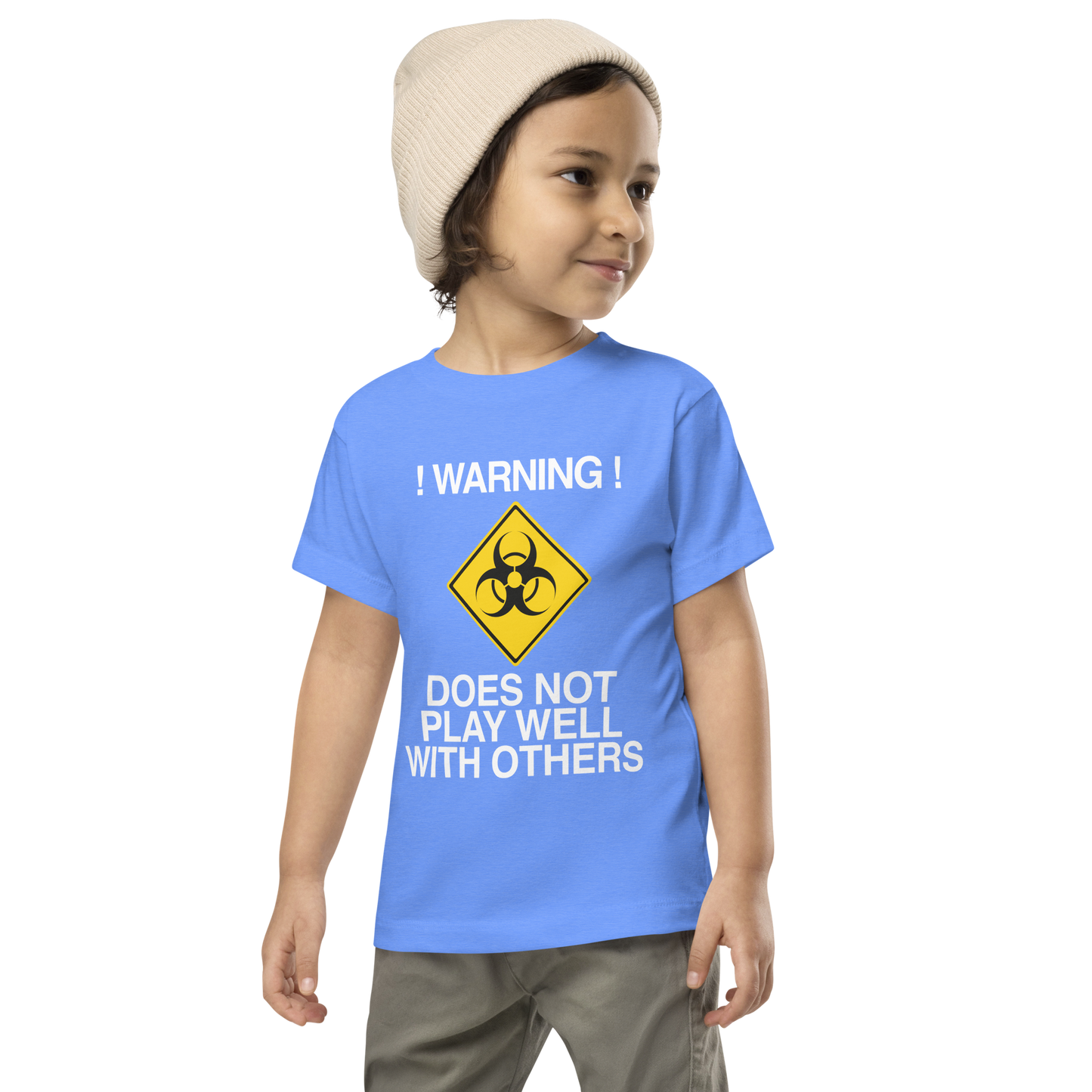 "!Warning! Does Not Play Well With Others" printed on a heather columbia blue toddler short sleeve tee worn by a male wearing a cap