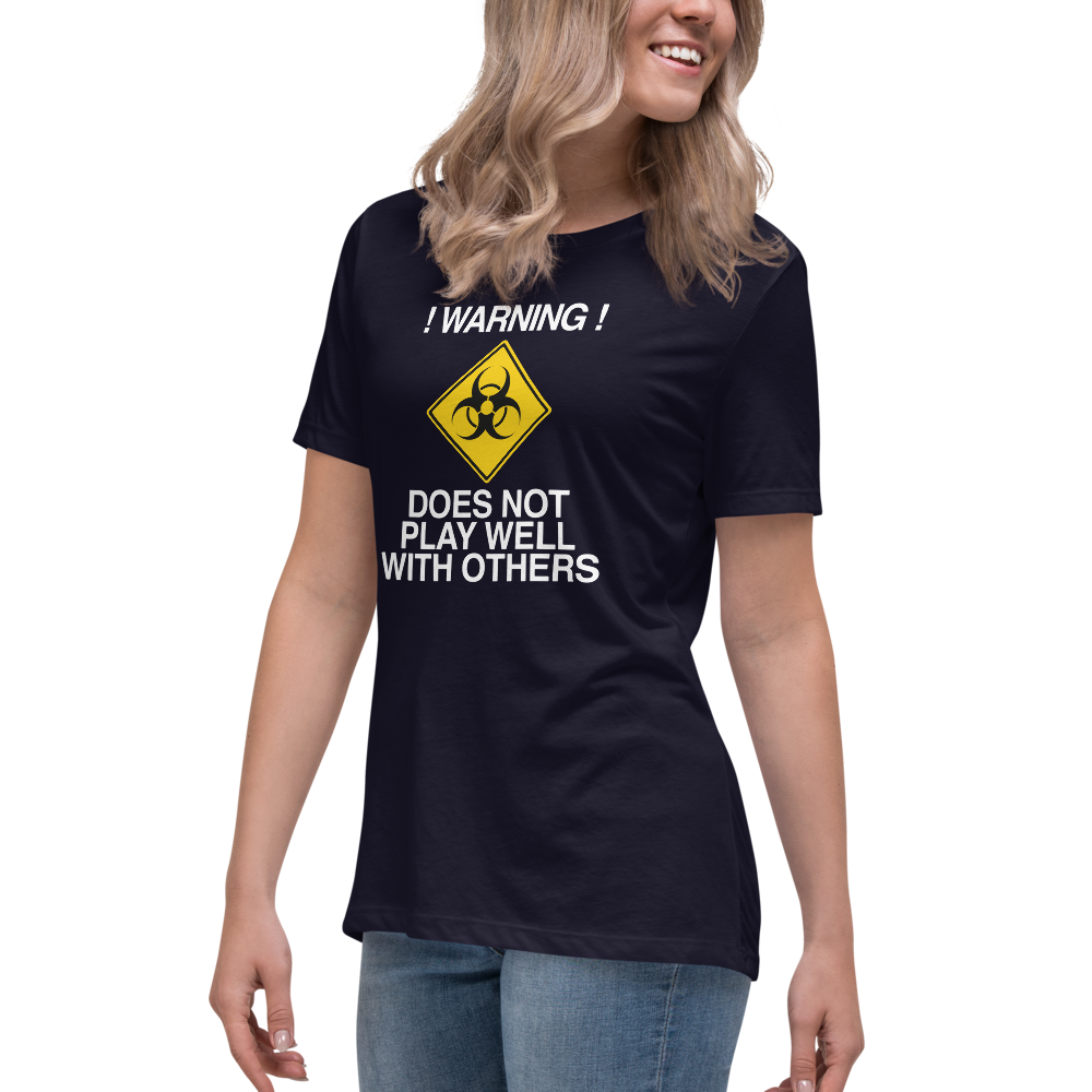 "!Warning! Does Not Play Well With Others" printed on a navy women's relaxed t-shirt worn by a female