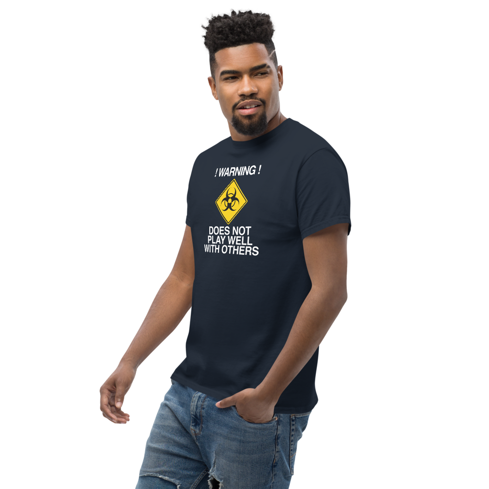 "!Warning! Does Not Play Well With Others" printed on a navy unisex classic tee worn by a male