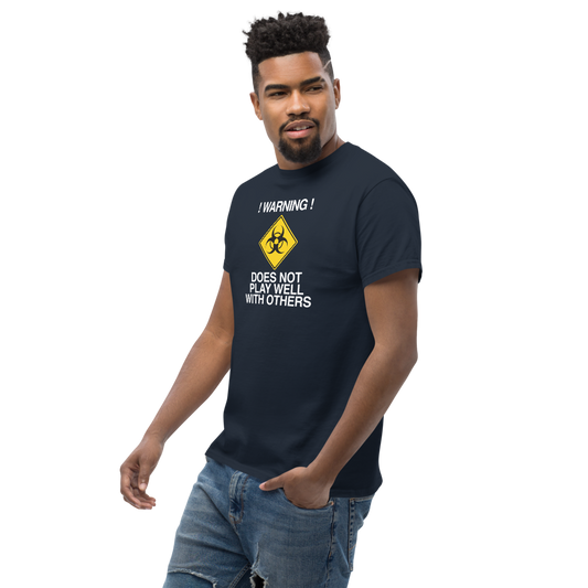 "!Warning! Does Not Play Well With Others" printed on a navy unisex classic tee worn by a male