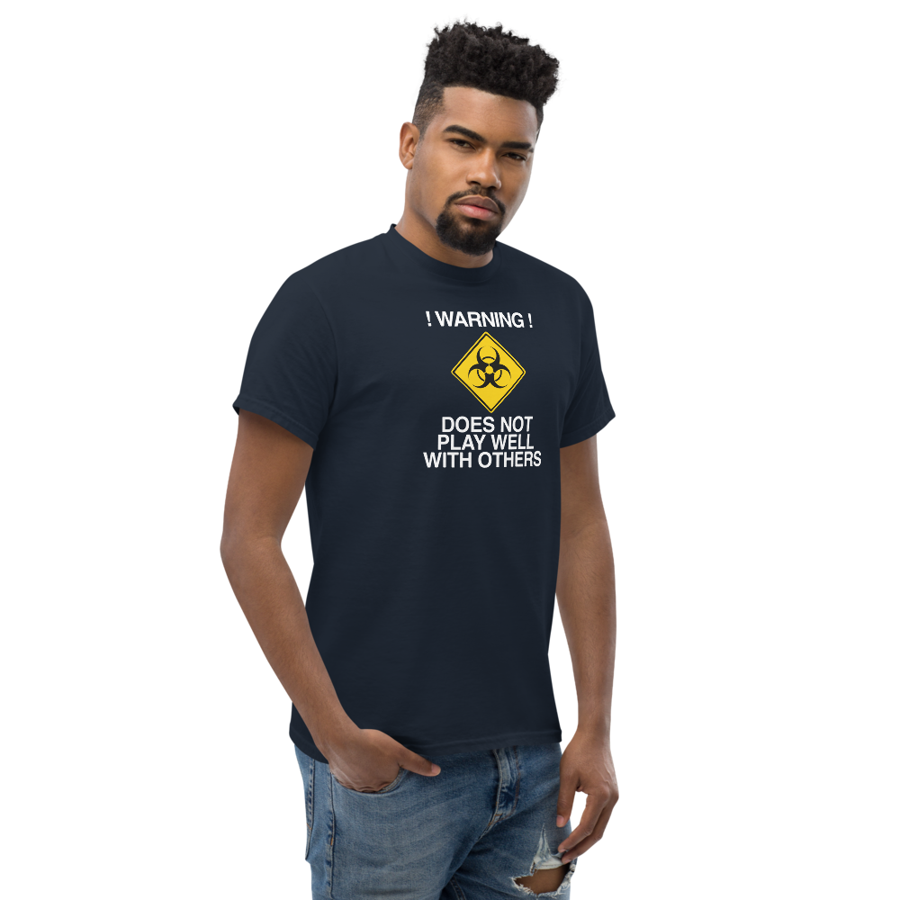 "!Warning! Does Not Play Well With Others" printed on a navy unisex classic tee worn by a male