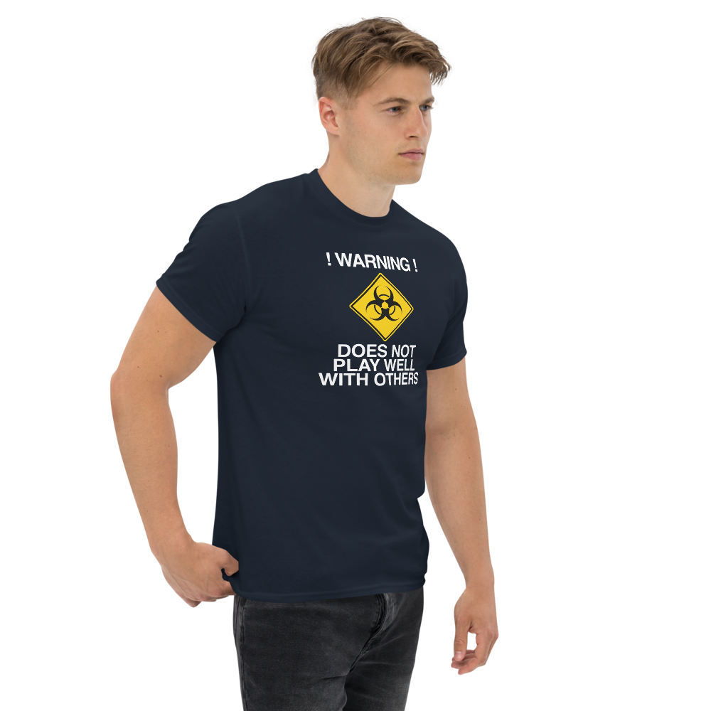 "!Warning! Does Not Play Well With Others" printed on a navy unisex classic tee worn by a male