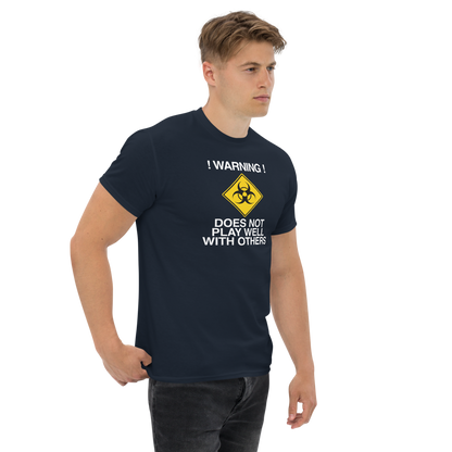 "!Warning! Does Not Play Well With Others" printed on a navy unisex classic tee worn by a male