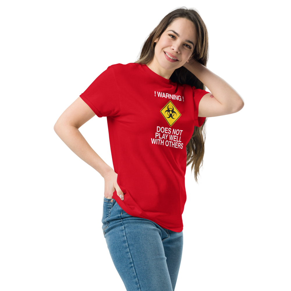 "!Warning! Does Not Play Well With Others" printed on a red unisex classic tee worn by a female