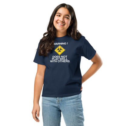 "!Warning! Does Not Play Well With Others" printed on a navy youth classic tee worn by a female