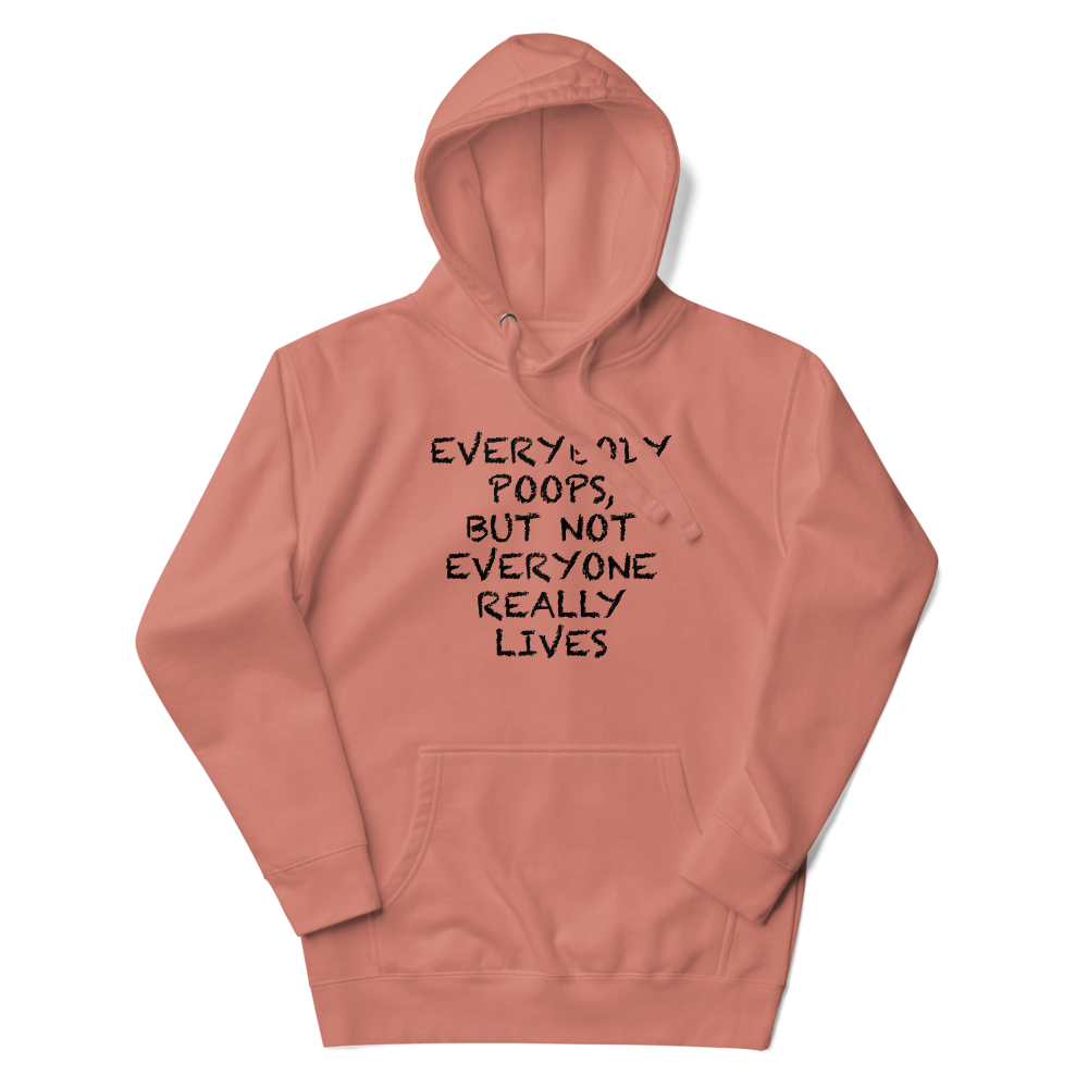 "Everybody poops, but not everyone really lives" printed on a dusty rose unisex hoodie laying on a flat surface with the hood up