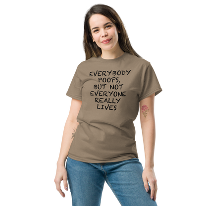 "Everybody poops, but not everyone really lives" printed on a brown savana unisex classic tee worn by a female
