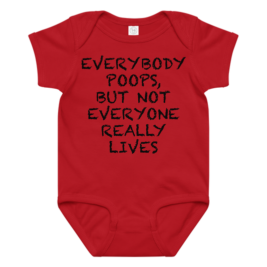 "Everybody poops, but not everyone really lives" printed on a red baby jersey bodysuit laying on a flat surface amongst other clothes