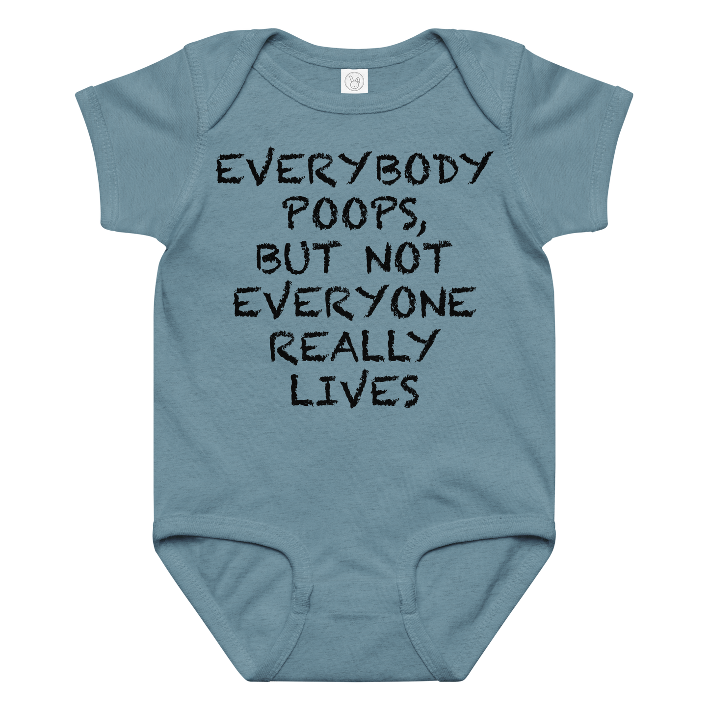 "Everybody poops, but not everyone really lives" printed on a vintage indigo baby jersey bodysuit laying on a flat surface amongst other clothes