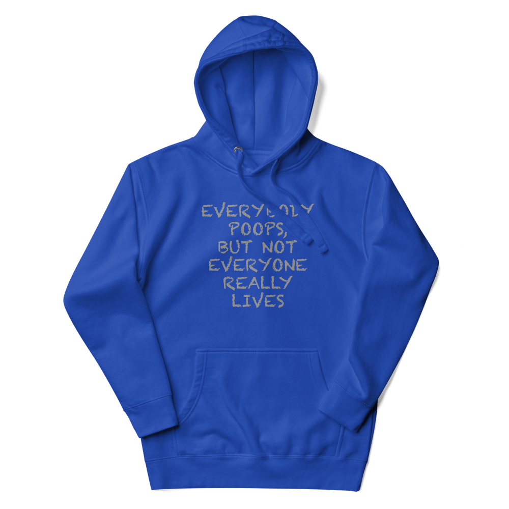 "Everybody poops, but not everyone really lives" printed on a team royal unisex hoodie laying on a flat surface with the hood up