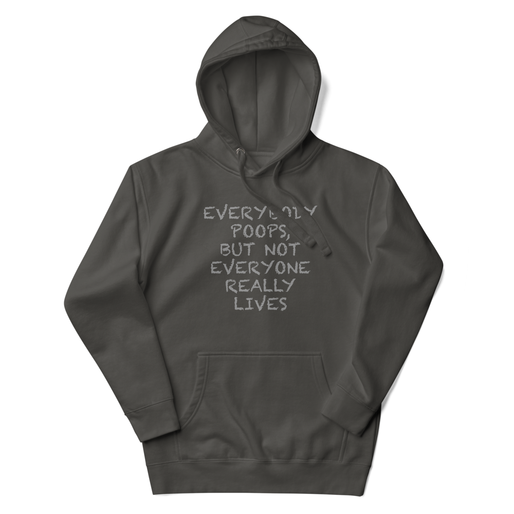 "Everybody poops, but not everyone really lives" printed on a vintage black unisex hoodie laying on a flat surface with the hood up