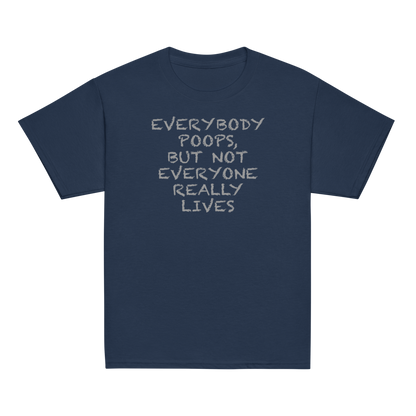 "Everybody poops, but not everyone really lives" printed on a navy youth classic tee laying on a flat surface