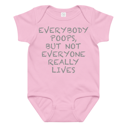 "Everybody poops, but not everyone really lives" printed on a pink baby jersey bodysuit laying on a flat surface amongst other clothes