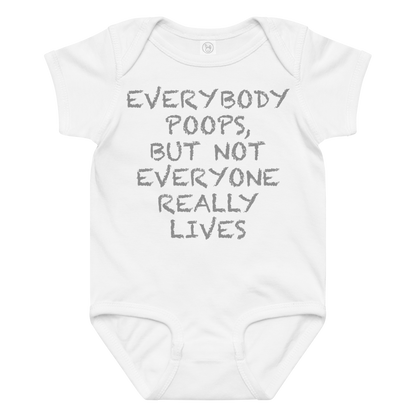 "Everybody poops, but not everyone really lives" printed on a white baby jersey bodysuit laying on a flat surface amongst other clothes